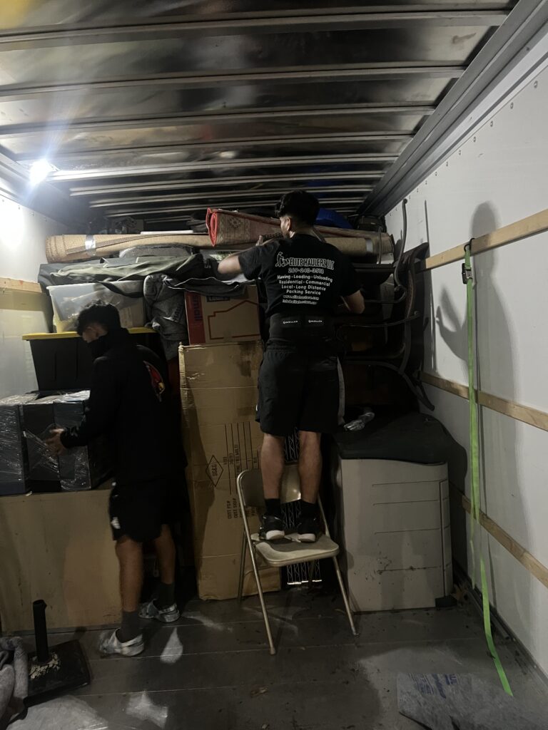 Two Elite Haulerz movers packing a truck in Benton Harbor, MI
