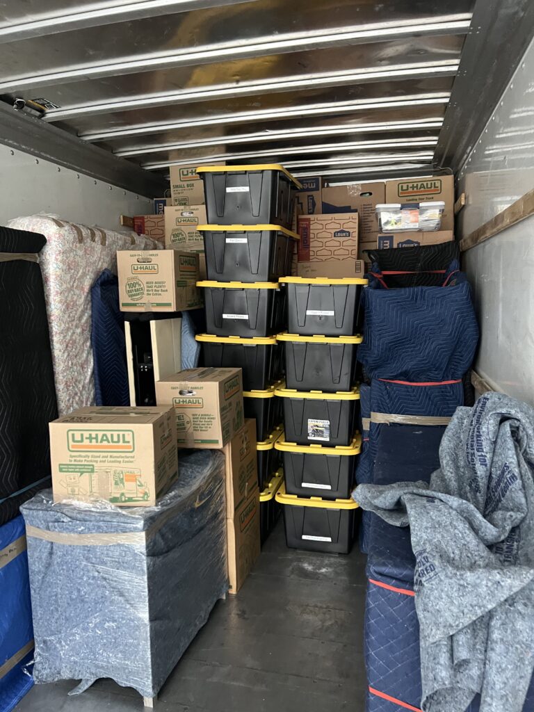 Professionally packed truck with boxes. Movers packed it