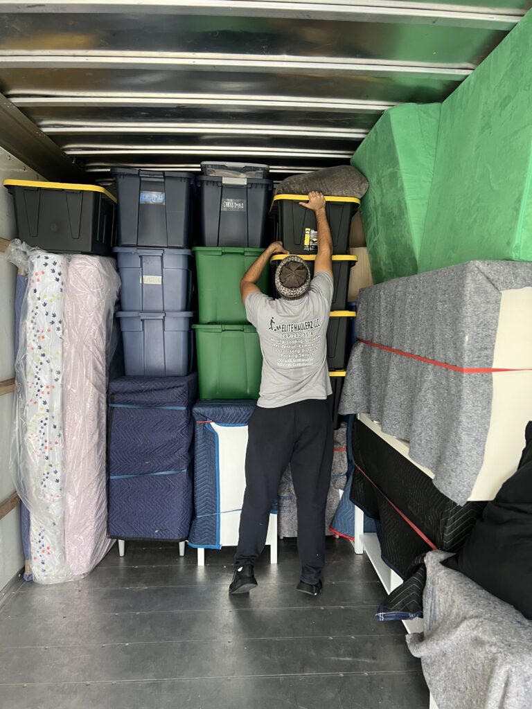 Mover from Elite Haulerz packing a truck