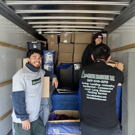 Three Elite Haulerz movers inside a truck moving stuff in southbend, IN